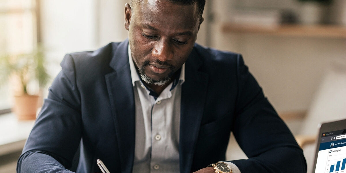A buyer reviewing mortgage paperwork and the MREIF credit score requirements